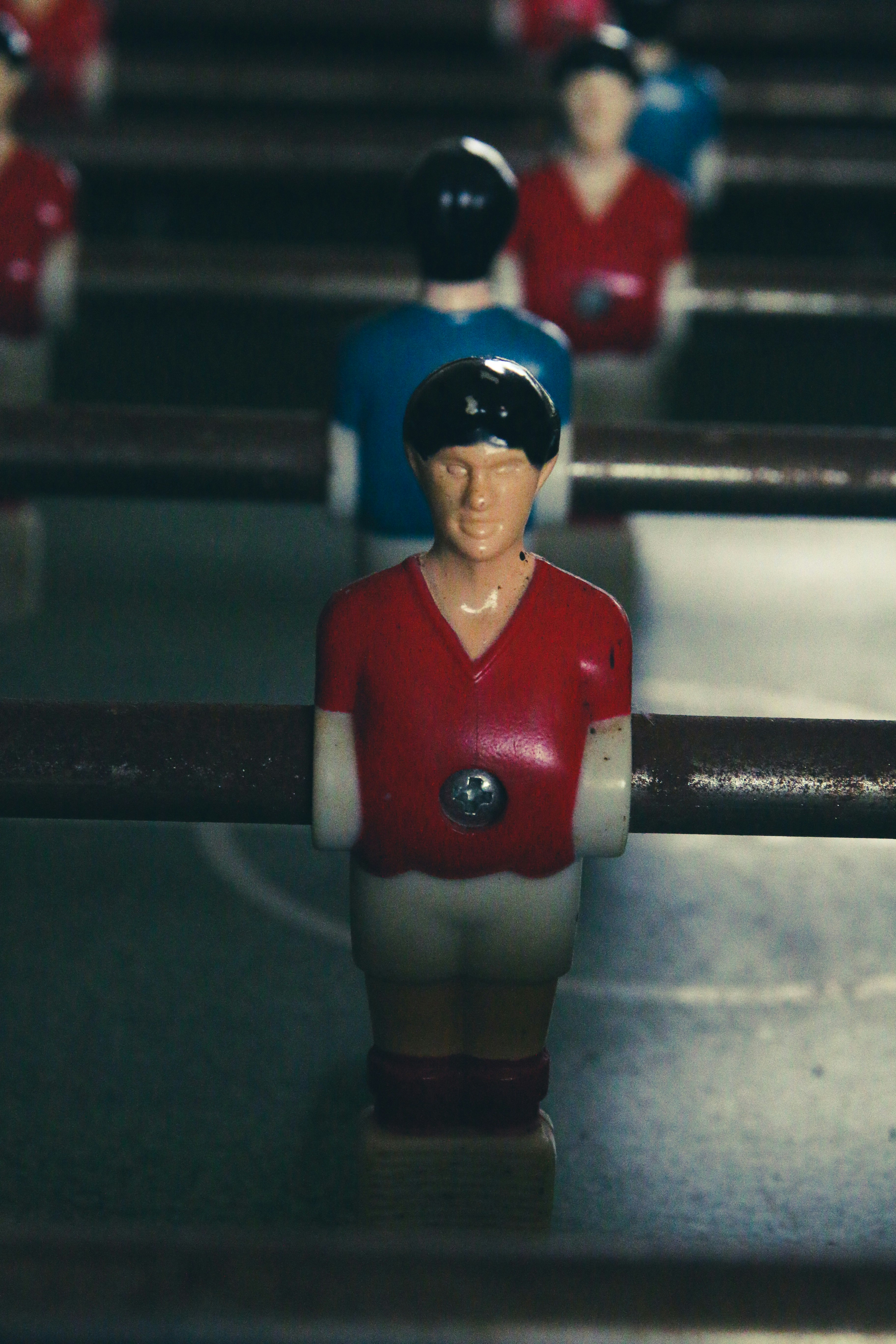 man in red and blue jersey shirt and blue cap figurine